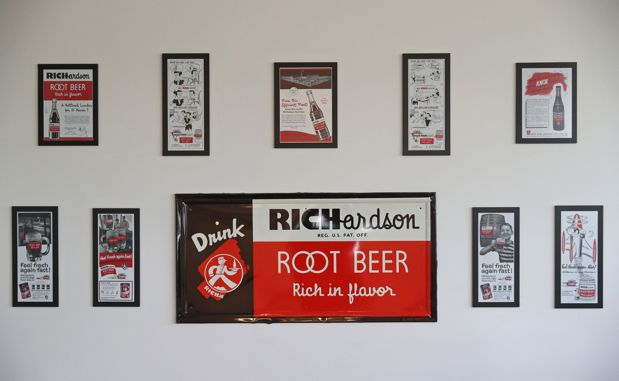 Historical advertisements of Richardson products hang on a wall at the Baldwin Richardson Foods innovation center.