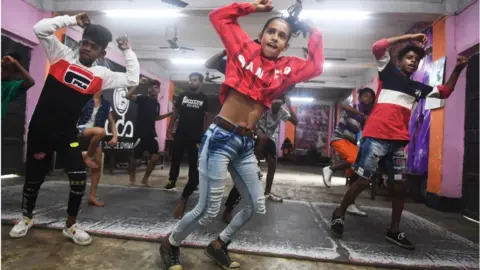 Getty Images Gymnasts in India perform a TikTok dance in 2019