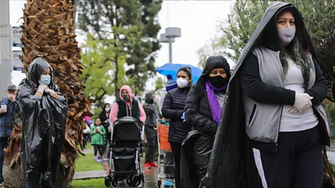 Getty Images People wait in line at a food bank in Van Nuys, California, where organisers said they had distributed food for 1,500 families amid the spread of Covid-19 (Credit: Getty Images)