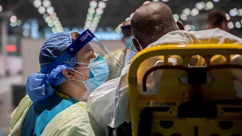Getty Images An army sergeant speaks to a patient at the Javits New York Medical Station, which supports local hospitals in New York City (Credit: Getty Images)