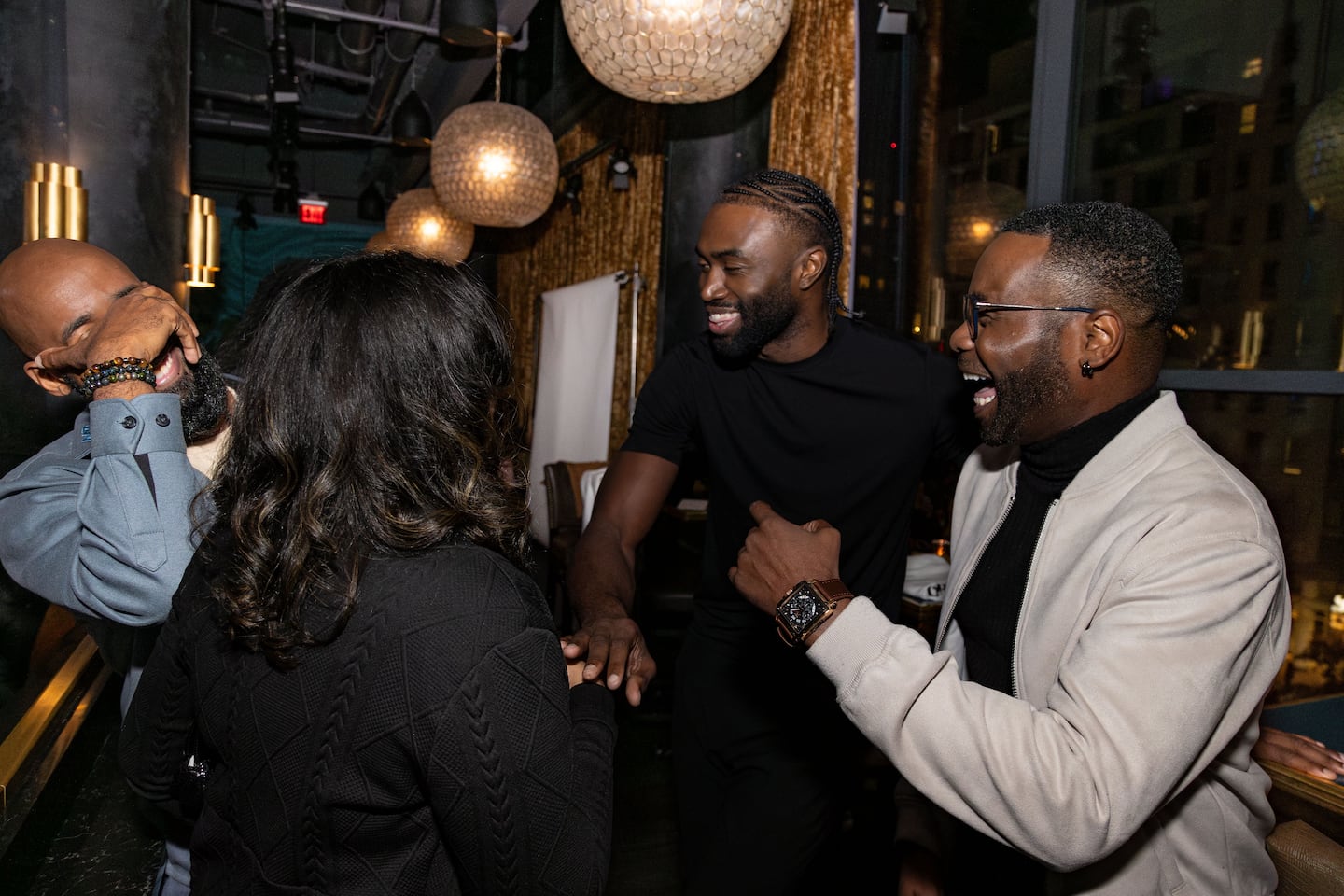 Jaylen Brown with the founders of Anawan Studios.