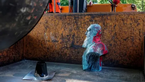 AFP This bust of Leopold II was removed on Friday in Auderghem, near Brussels