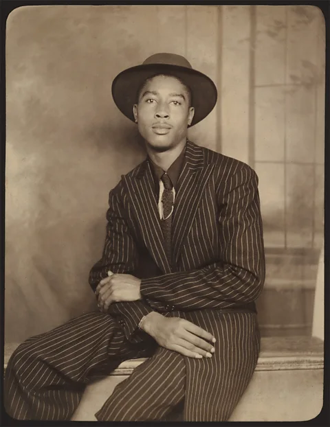 Metropolitan Museum of Art A studio portrait of an unnamed American man in 1940s or 50s shows a pinstriped suit with roomy proportions that was typical of the era (Credit: Metropolitan Museum of Art)